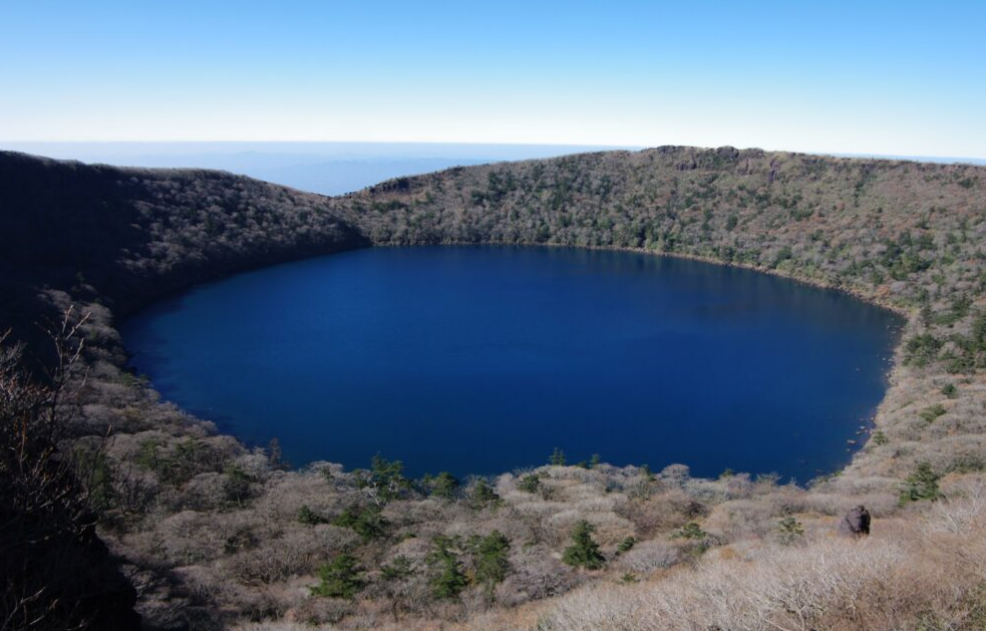 Onami-ike crater lake surrounded by forest