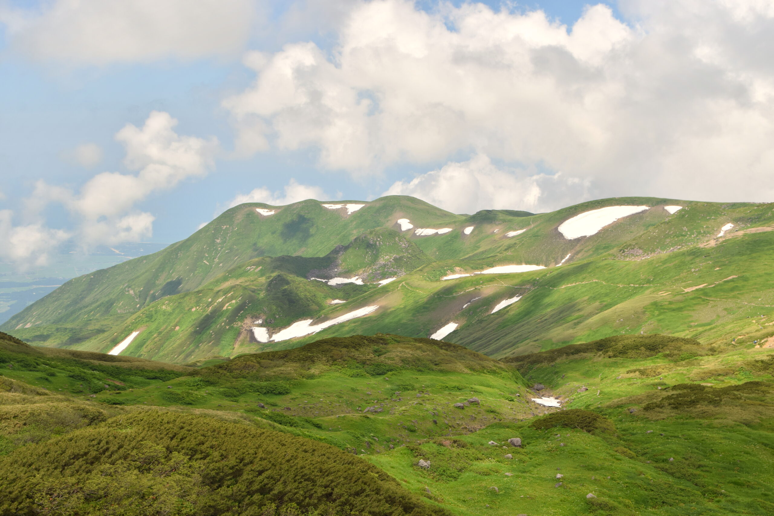 Green alpine slopes on the trail up Mount Chokai