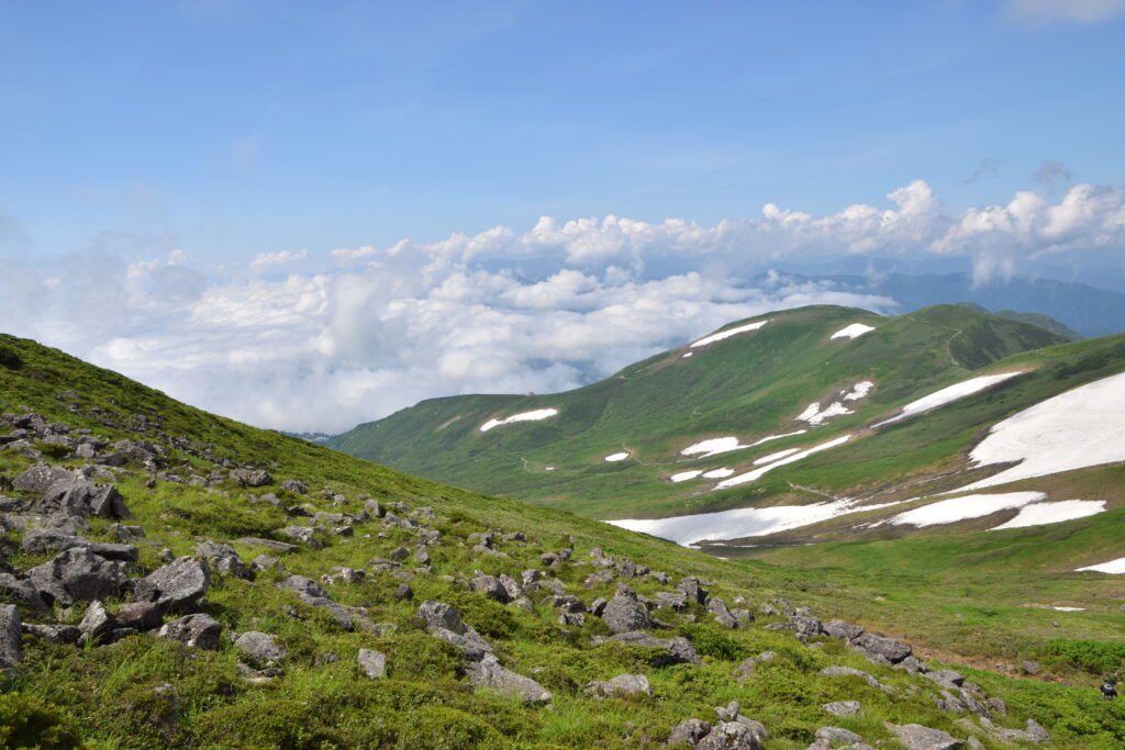 Mount Gassan rising above green slopes in Yamagata