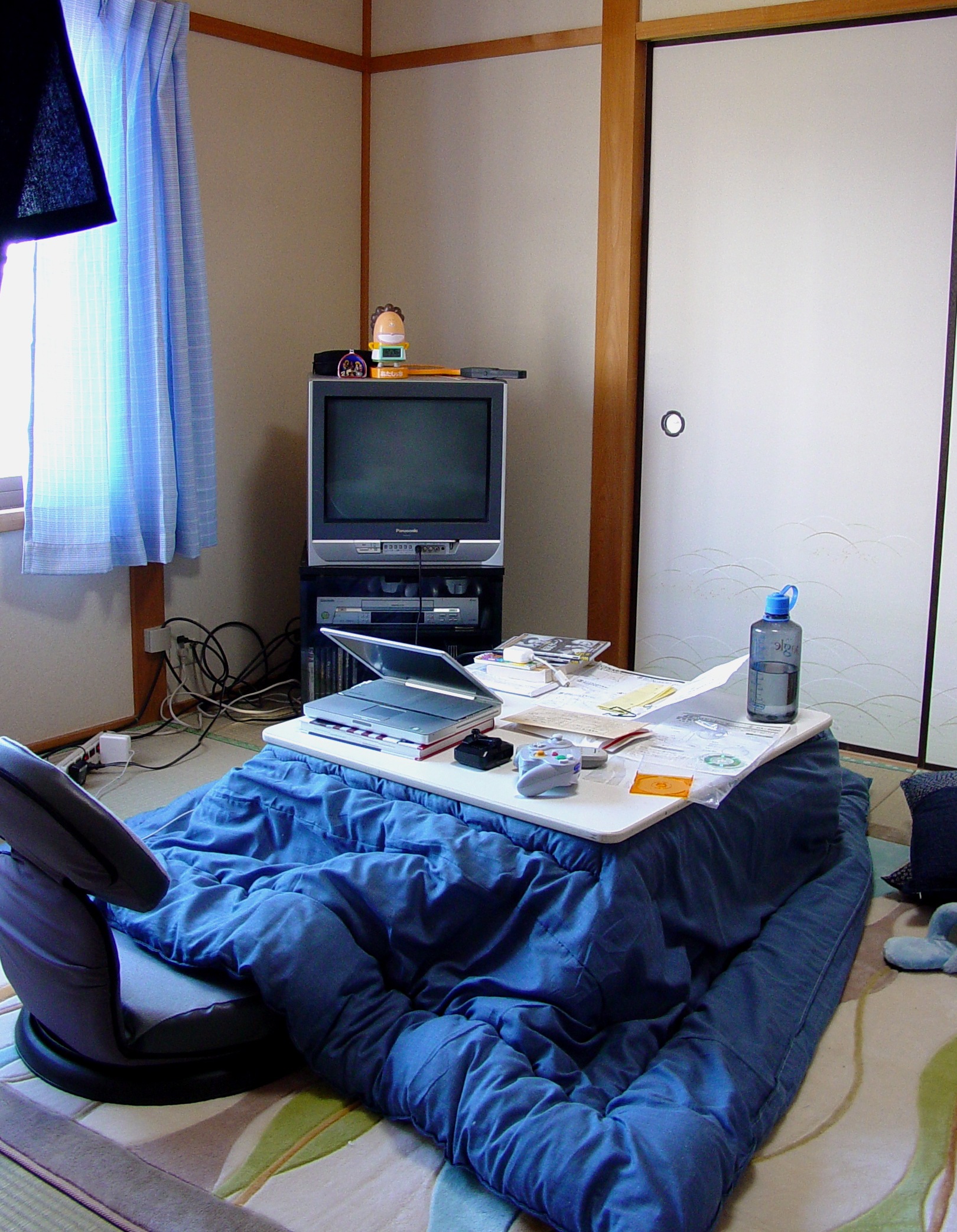 A kotatsu table with a thick blanket in a cozy Japanese living room