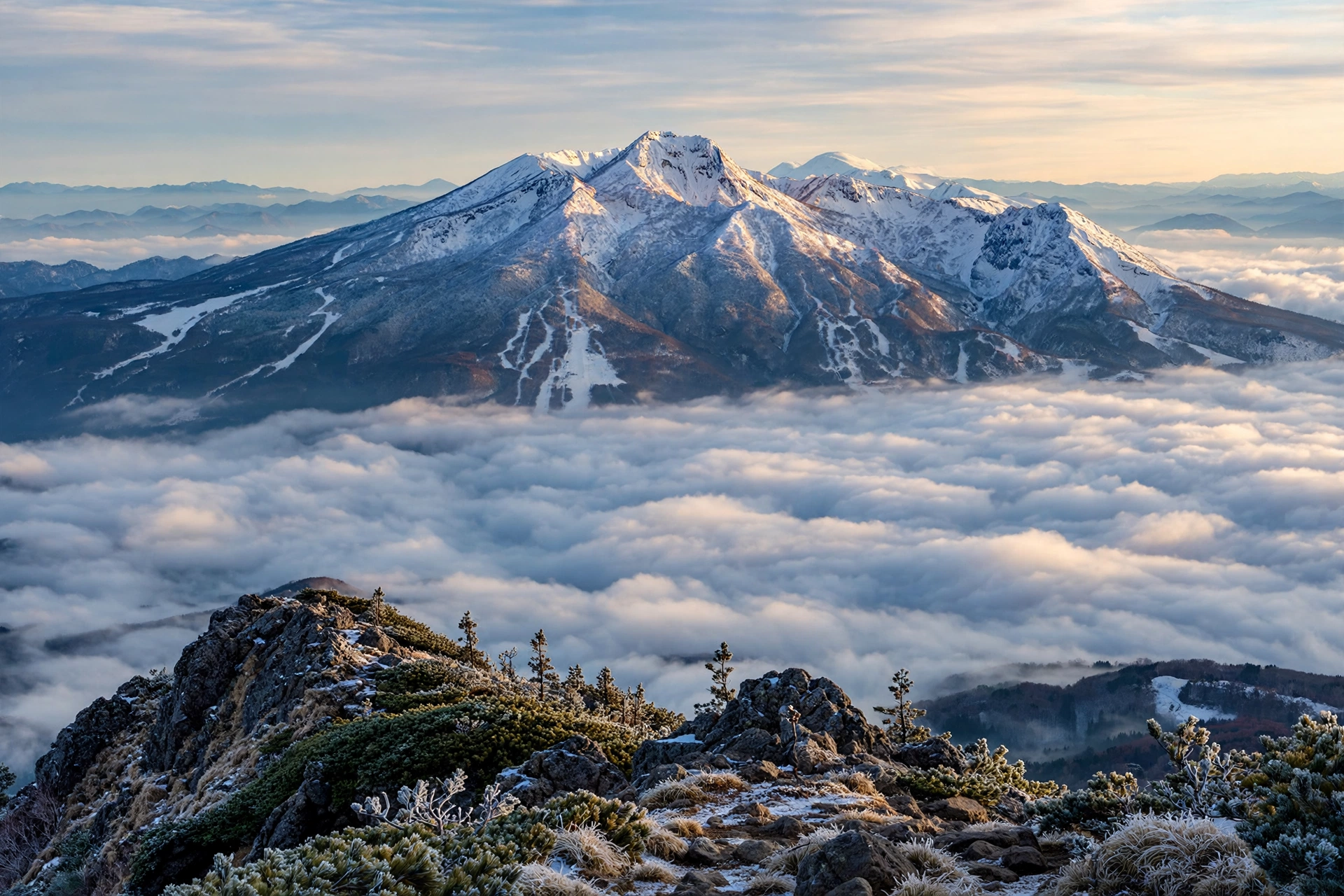 Mount Myoko volcano rising above clouds in Niigata, Japan